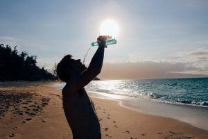 man drinking pure water